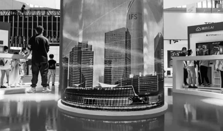 Man standing by a column that reflects the city around him